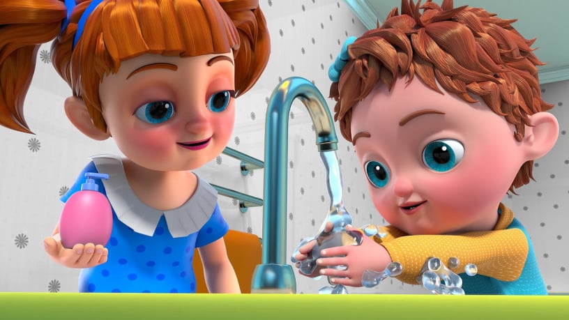 A 3D cartoon illustration of a young girl with orange hair holding a pink soap dispenser while a little Emma washes her hands with soapy bubbles under a running tap.